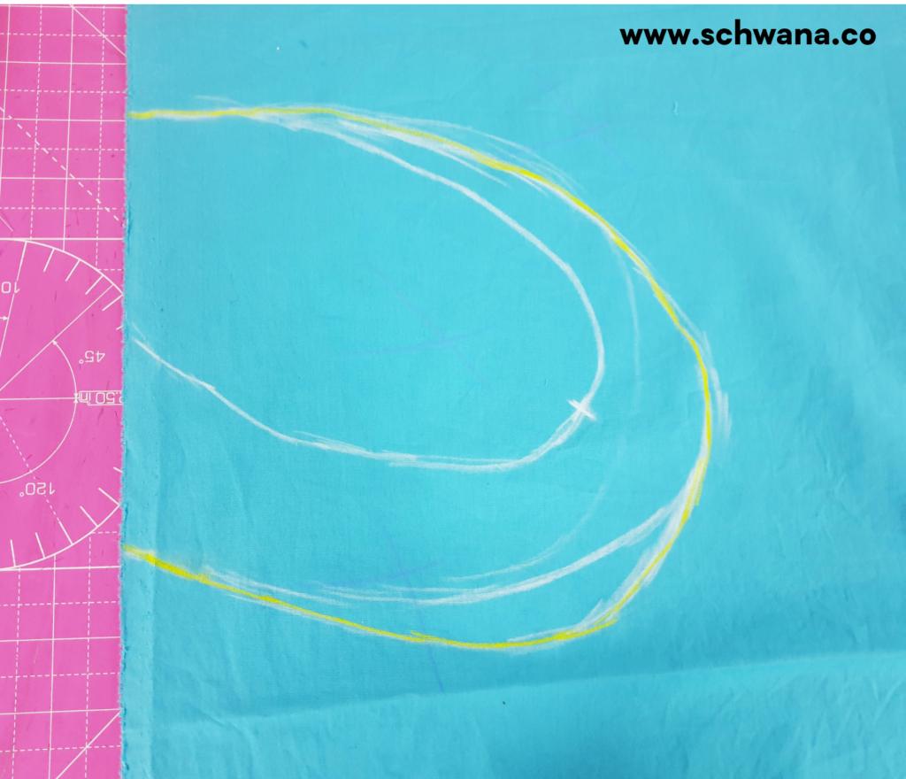 Outlining the final pocket shape in yellow tailor's chalk.